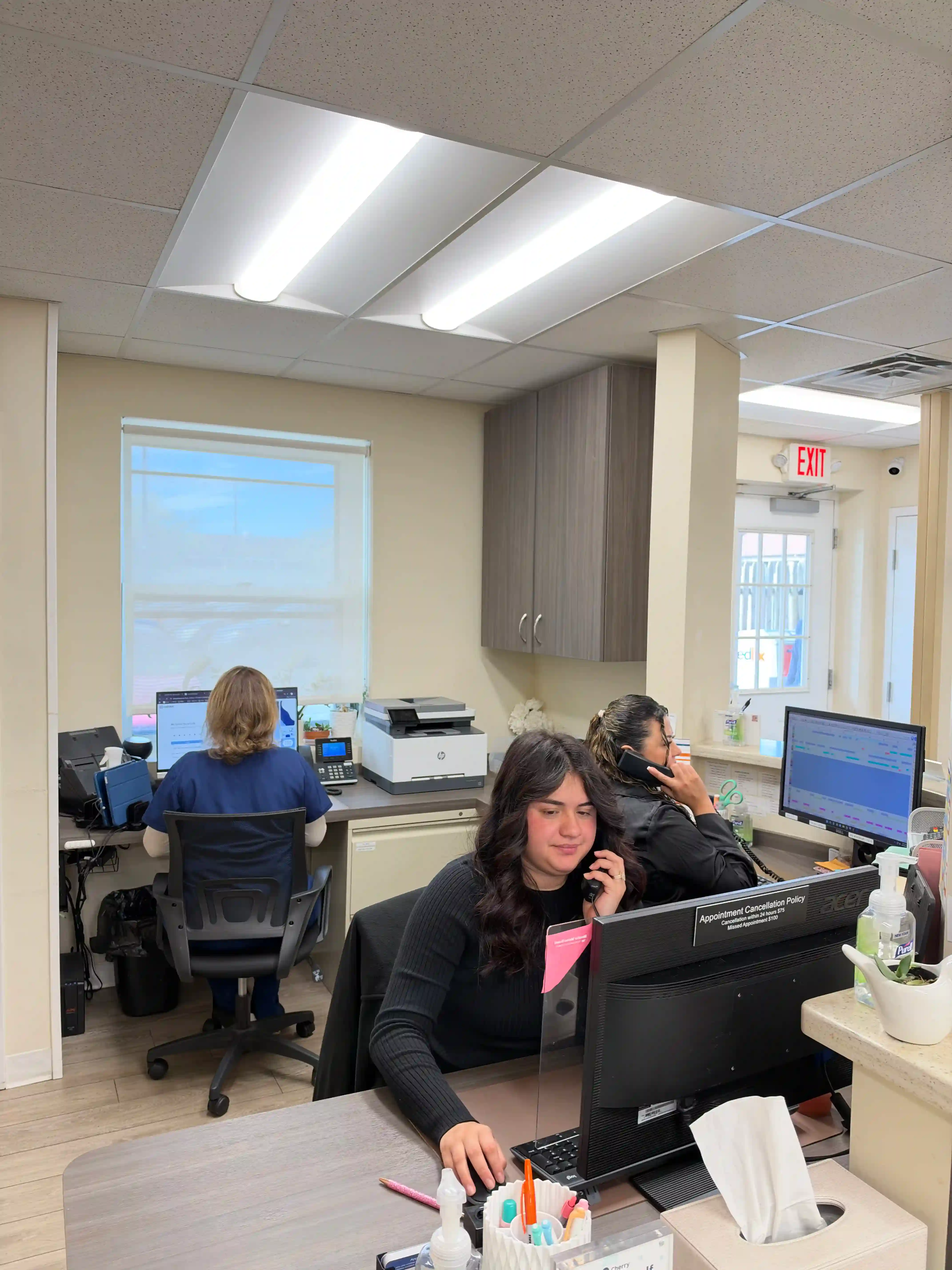 Front desk team welcoming new patients at Union Family Dental